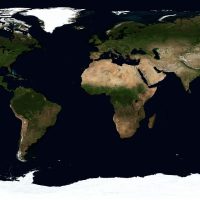 主编林知远戴着眼镜在书桌前比对两份地图高德卫星地图截图，台灯暖光映在纸面上，神情专注